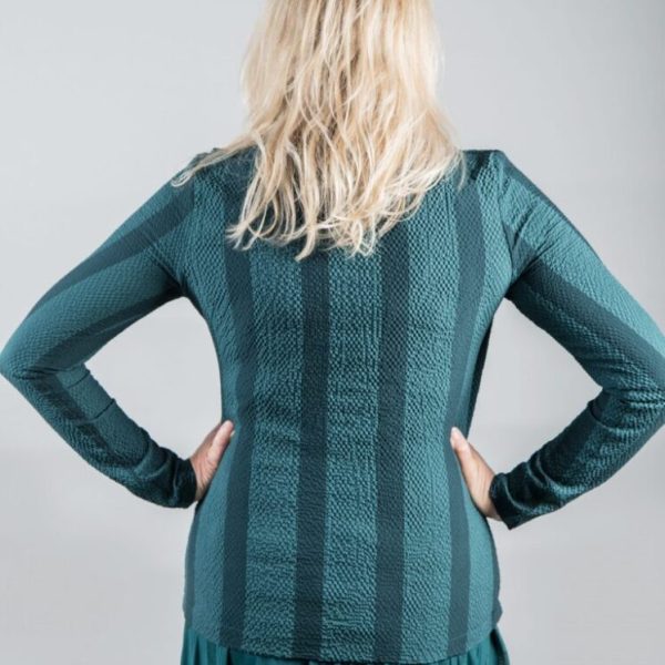 Elsewhere B-Yikama striped petrol green top is unconventional in its design with a draping front. Available from colmershill.com