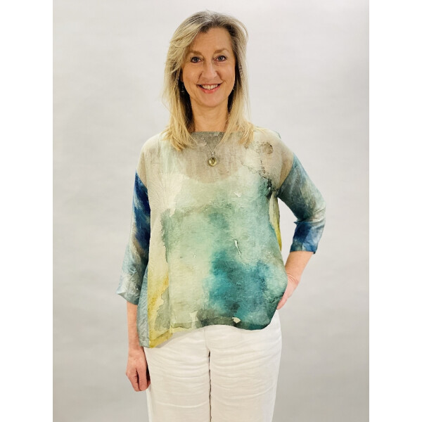 Yavi Silk Box Top in a watercolour style print with green, blue, yellow and greys . Available on colmershill.com
