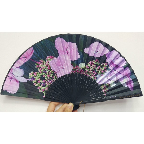 From My Mother's Garden hand opening hand fans are handmade in the traditional Oriental and Japanese style using the exclusive nature-inspired prints from the range. The Hydrangea fan has black spines and and handle with a pink hydrangea print. They come with a matching pouch. Available on top UK stockist colmershill.com