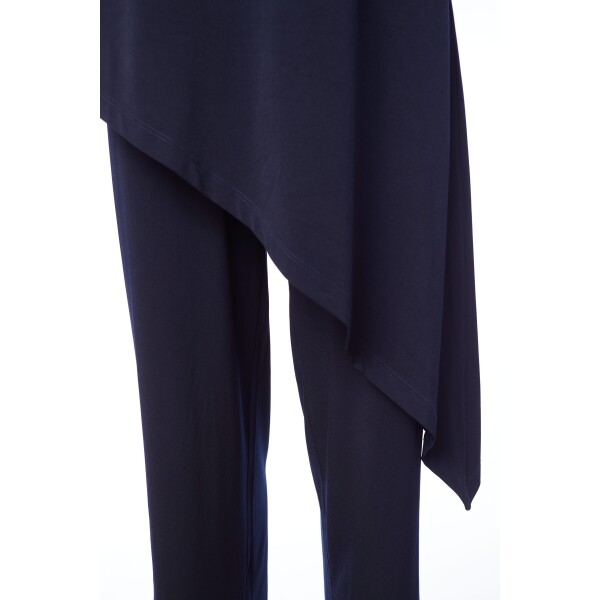 Naya jumpsuit in navy with an asymmetric tunic top. It has a round neckline and is a great day to evening piece. NAS24165.