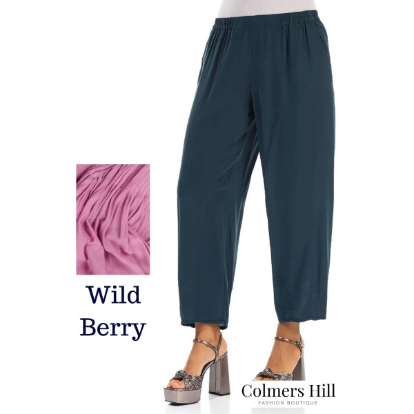 Grizas tapered trousers made of a silk linen fabric in wild berry. They are slightly cropped and have an elasticated waist. Available on Colmershill.com, UK stockist