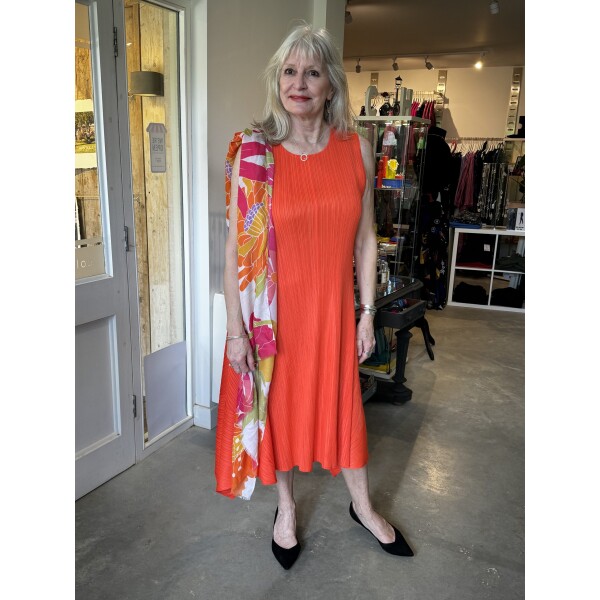 Thanny Sleeveless Plissé Dress in Orange is a midi dress in a pleated fabric