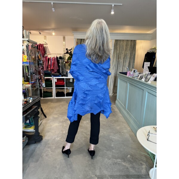 Thanny Long Plisse Jacket in Sky Blue is made from a pleated fabric and has a 3-D peak texture SKY9036