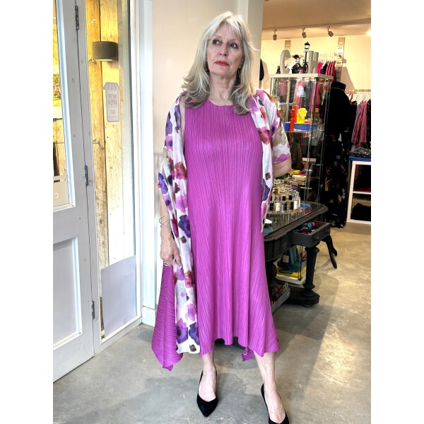 Thanny Sleeveless Plisse Midi Dress SKY17-14 in Fuchsia is a simple dress with dipped hems on the sides