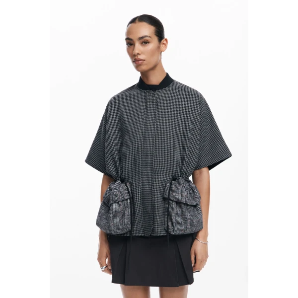Desigual Harringa Richmond Poncho in houndstooth with Accordion pockets on the front and adjustable ties around the waist