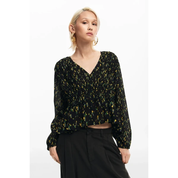 Desigual Okayama Blouse is slightly cropped with an elasticated waist detail and V-neck. It has a pretty, ditsy floral print in yellow on black