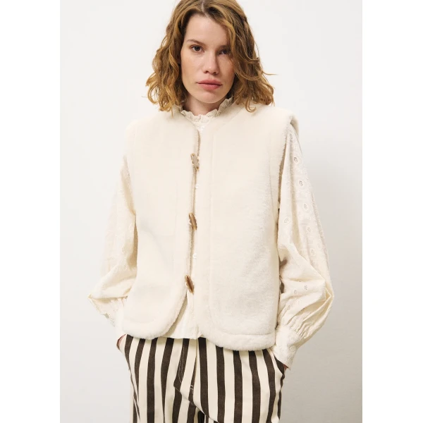FRNCH Simone reversible gilet with a check side in electric blue and a faux fur side in cream