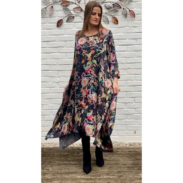 Out of Xile Flared Dress made of Habotai in a Flower print. It has a handkerchief hemline and great for a special occasion