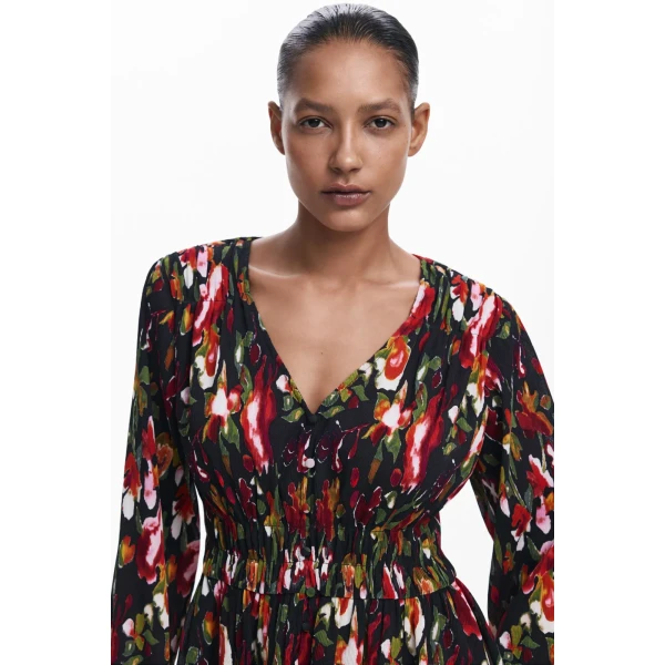 Desigual Kanazawa Blouse is cropped with a button up front and gathering around the waist. It has an arty floral print in beautiful autumnal colours 24WWBW09_2000