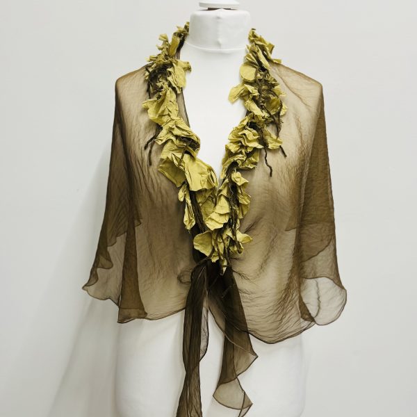 Out of Xile Silk Organza Cape in various colours. They have silk flower embellishments around the neckline