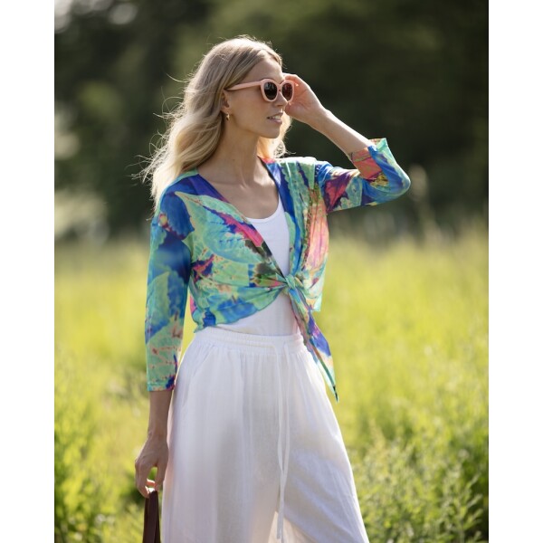 Aqua Neon Leaf Mesh Shrug by From My Mother's Garden comes in a vivid print which looks amazing over a plain dress or skirt, or palazzo trousers for example