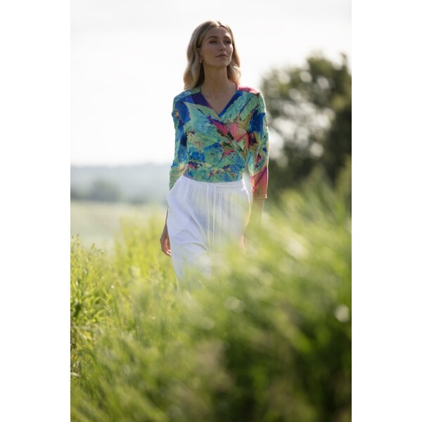 Aqua Neon Leaf Mesh Shrug by From My Mother's Garden comes in a vivid print which looks amazing over a plain dress or skirt, or palazzo trousers for example