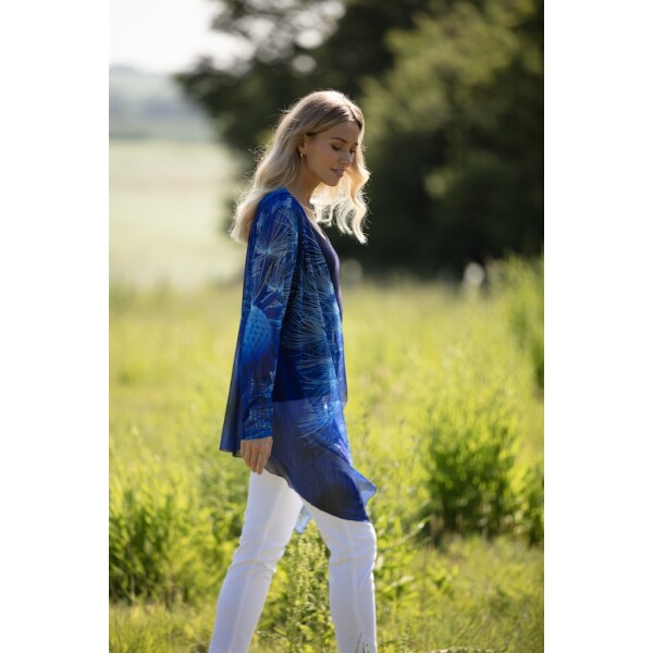 Wishes Long Mesh Shrug by From My Mother's Garden is a lightweight cover-up in a soft tulle fabric. It comes in a Dandelion Clock print in a striking royal blue colour