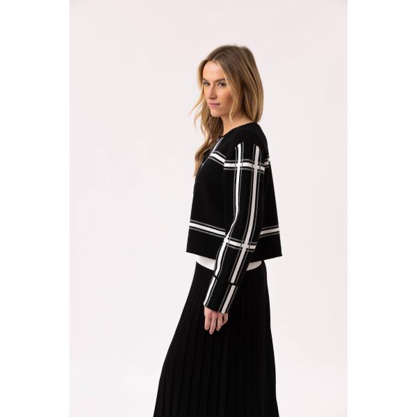 Side view of Marble Check Cardigan Black – long sleeve women’s knit with bold check pattern.