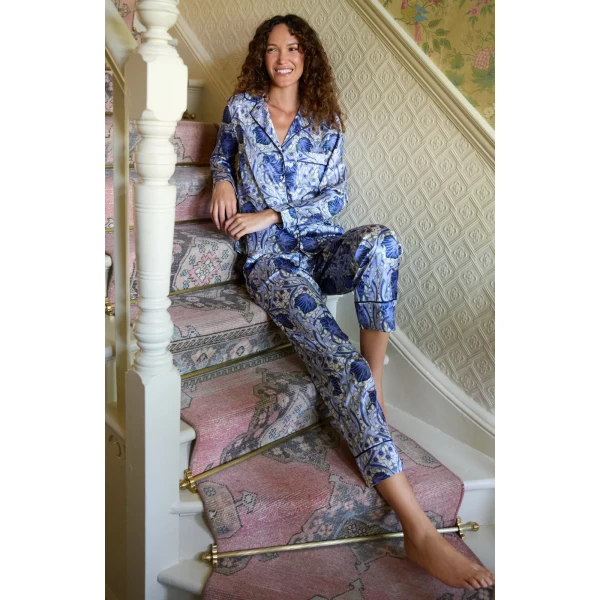 Model wearing Hope & Ivy Izzy Satin Print Pyjamas featuring William Morris Pimpernel design and button-up shirt.