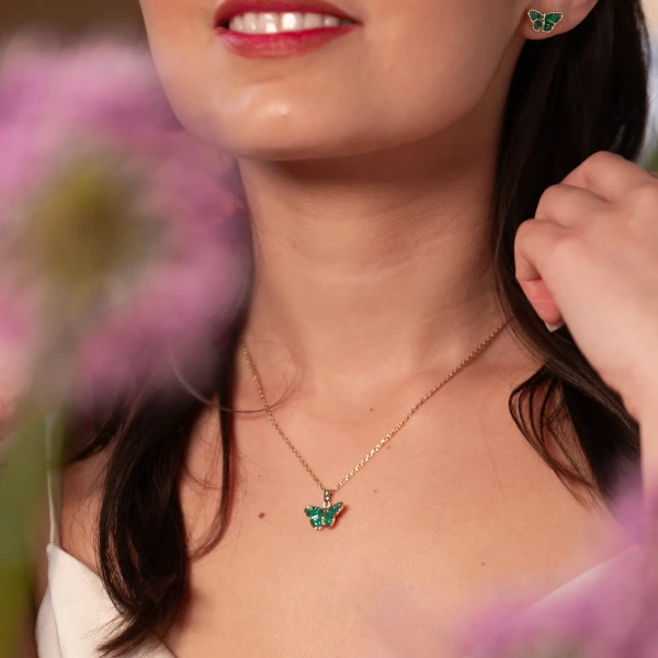 A charming blue butterfly enamel pendant necklace.  Brilliant butterfly wings meticulously hand-painted in vibrant shades of blue and black enamel.