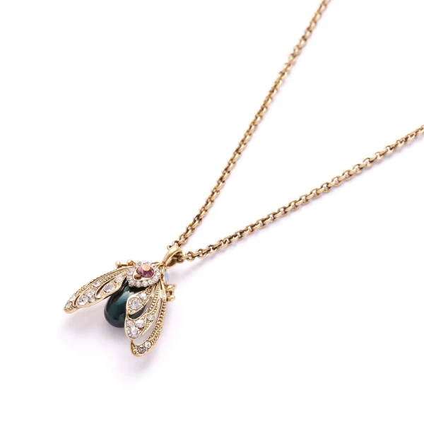 With a touch of vintage, this jewelled moth pendant necklace is just a little bit different! The moth pendant is decorated with synthetic pearls and handset crystals on a 18ct gold-plate construction