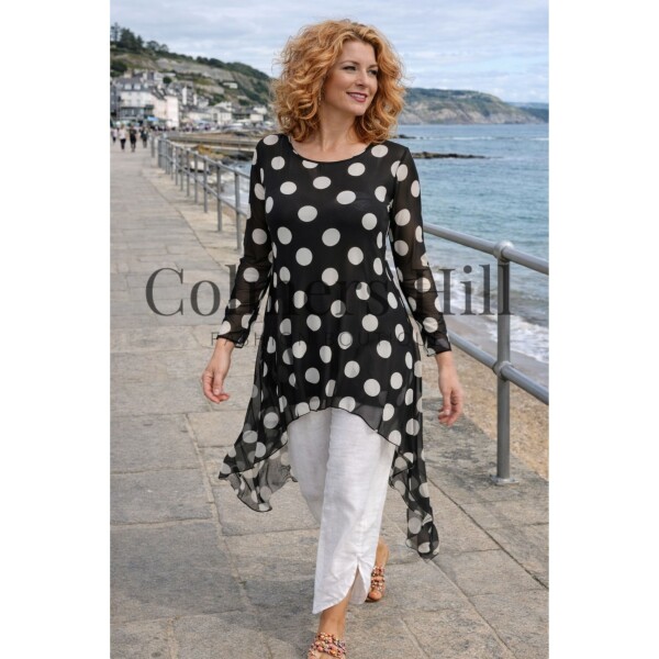 Kozan Mandy Tunic in the spotty black and white Dalmatian print. Made of a fine mesh fabric, it is semi-sheer