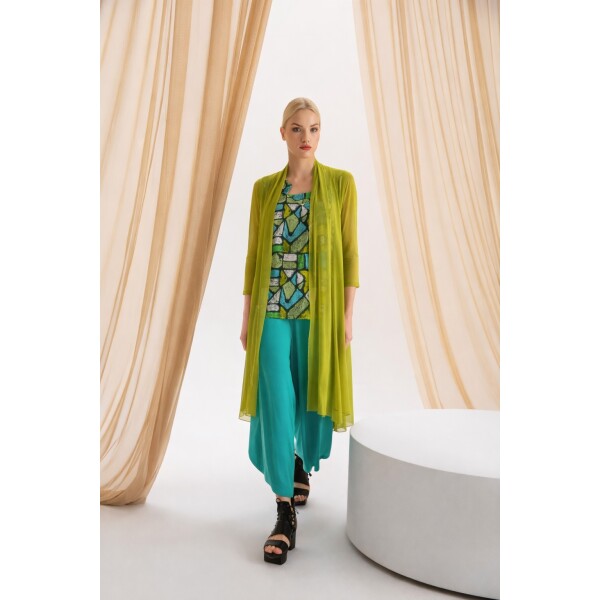 Kozan Model wearing the wide pants, Dream top and longline mesh cardigan in the SS26 range at colmershill.com