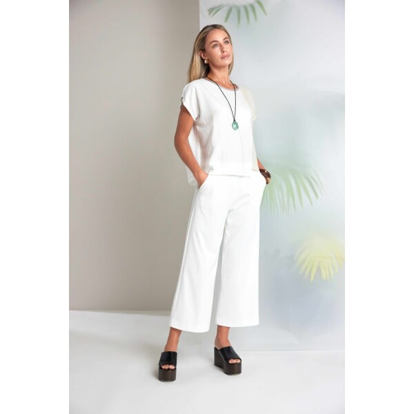 A refined essential from Naya Clothing, the Naya Wide Leg Soft Pull Up Trouser in cream reflects the brand’s contemporary Irish Design philosophy