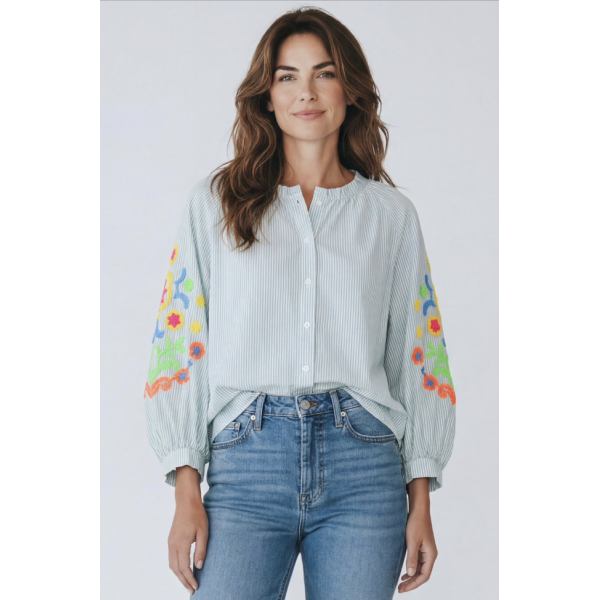 Oversized striped boho shirt styled with jeans front tuck